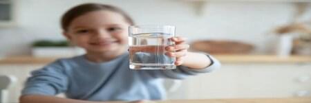 Children holding drinking water cup